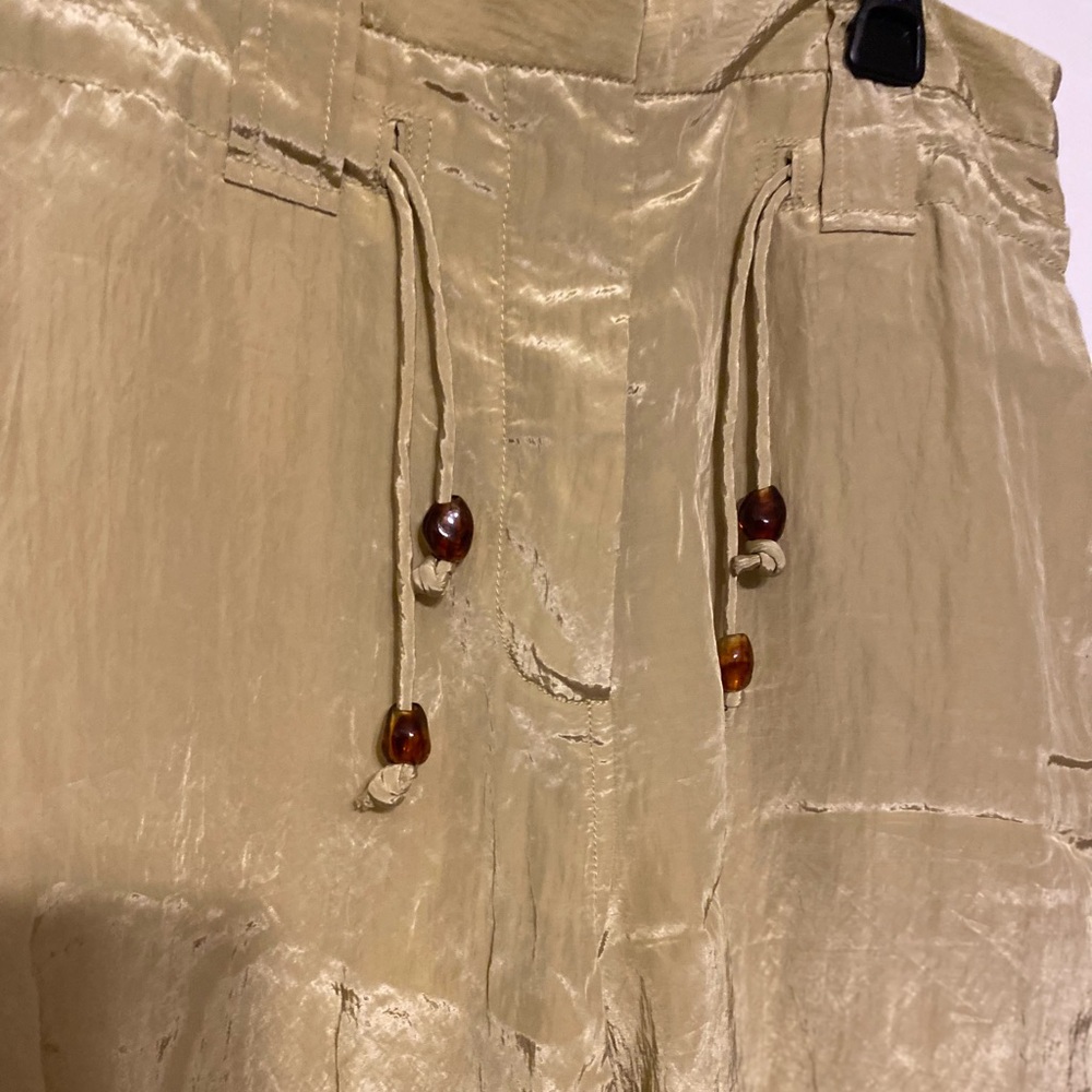 GANNI $595
Crinkled satin tapered pants dusty yellow size 36 size 0 - Picture 12 of 12